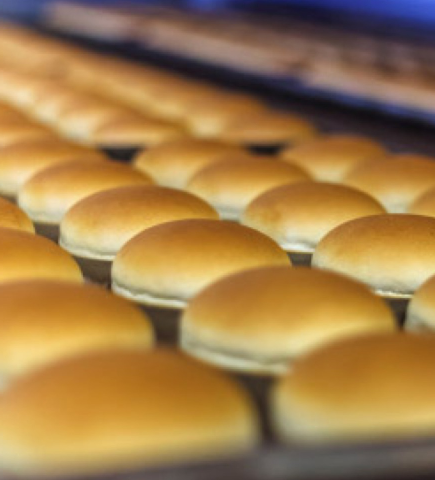 Northeast Foods sandwich buns on a baking sheet.